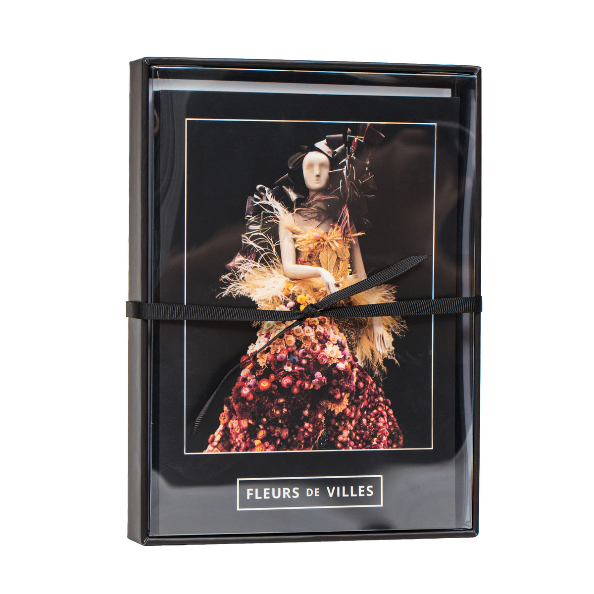 Greeting card product packaging with a woman in a colorful dress and 'Fleurs de Villes' branding.