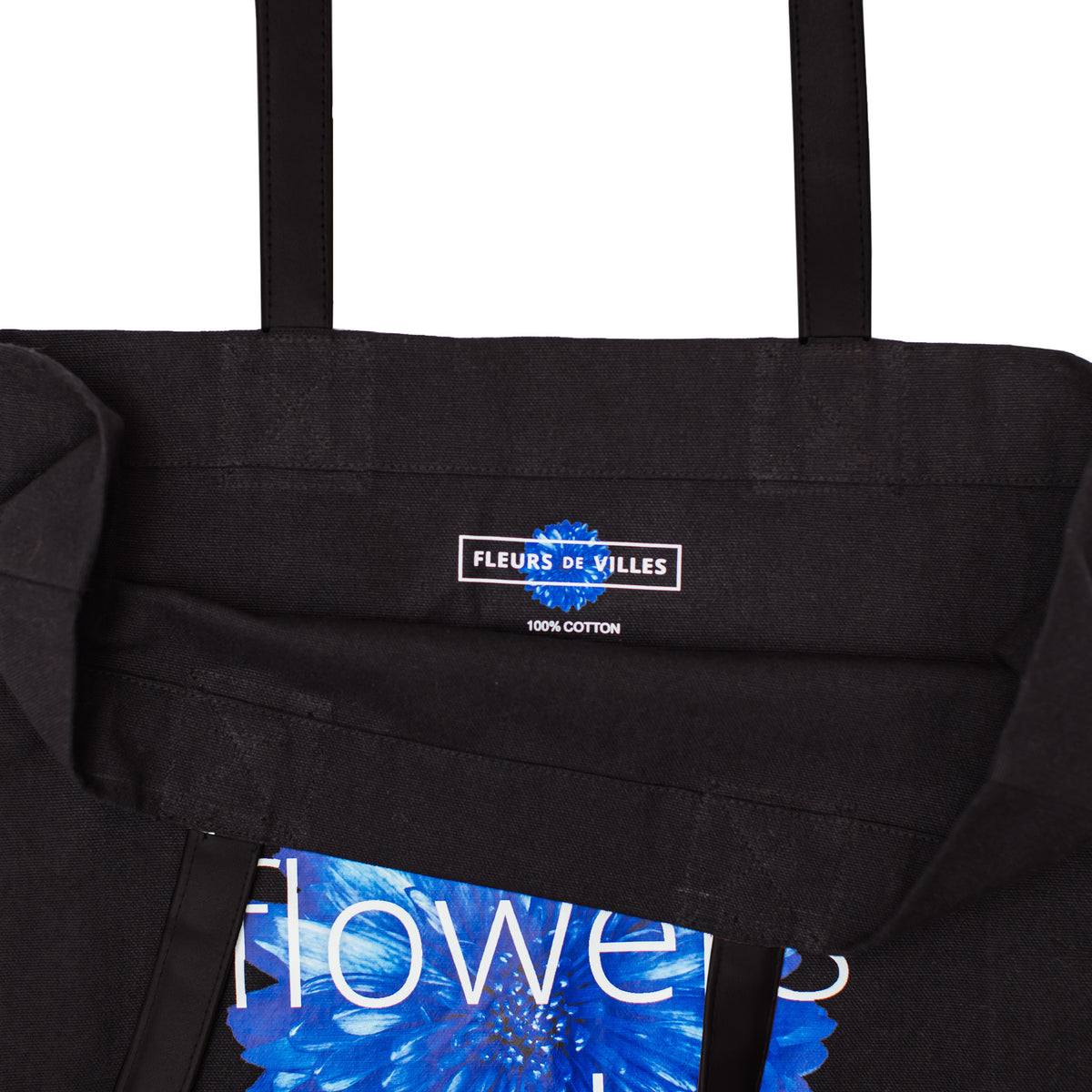 Black tote bag with a visible Fleurs de Villes brand label on a white background