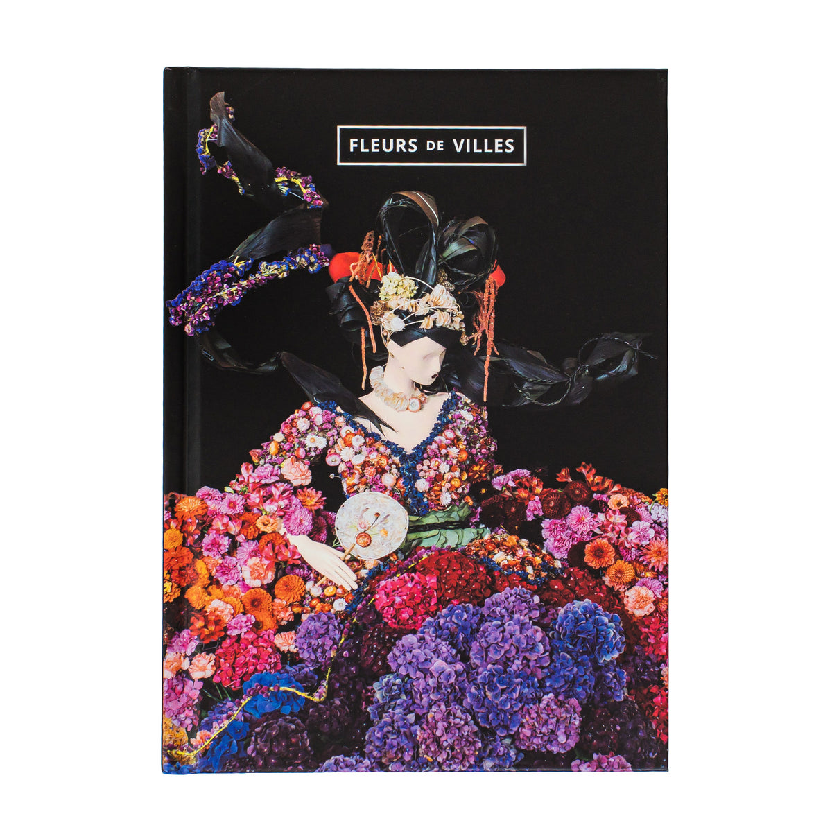 Notebook cover with a colorful floral mannequin and 'Fleurs de Villes' branding.